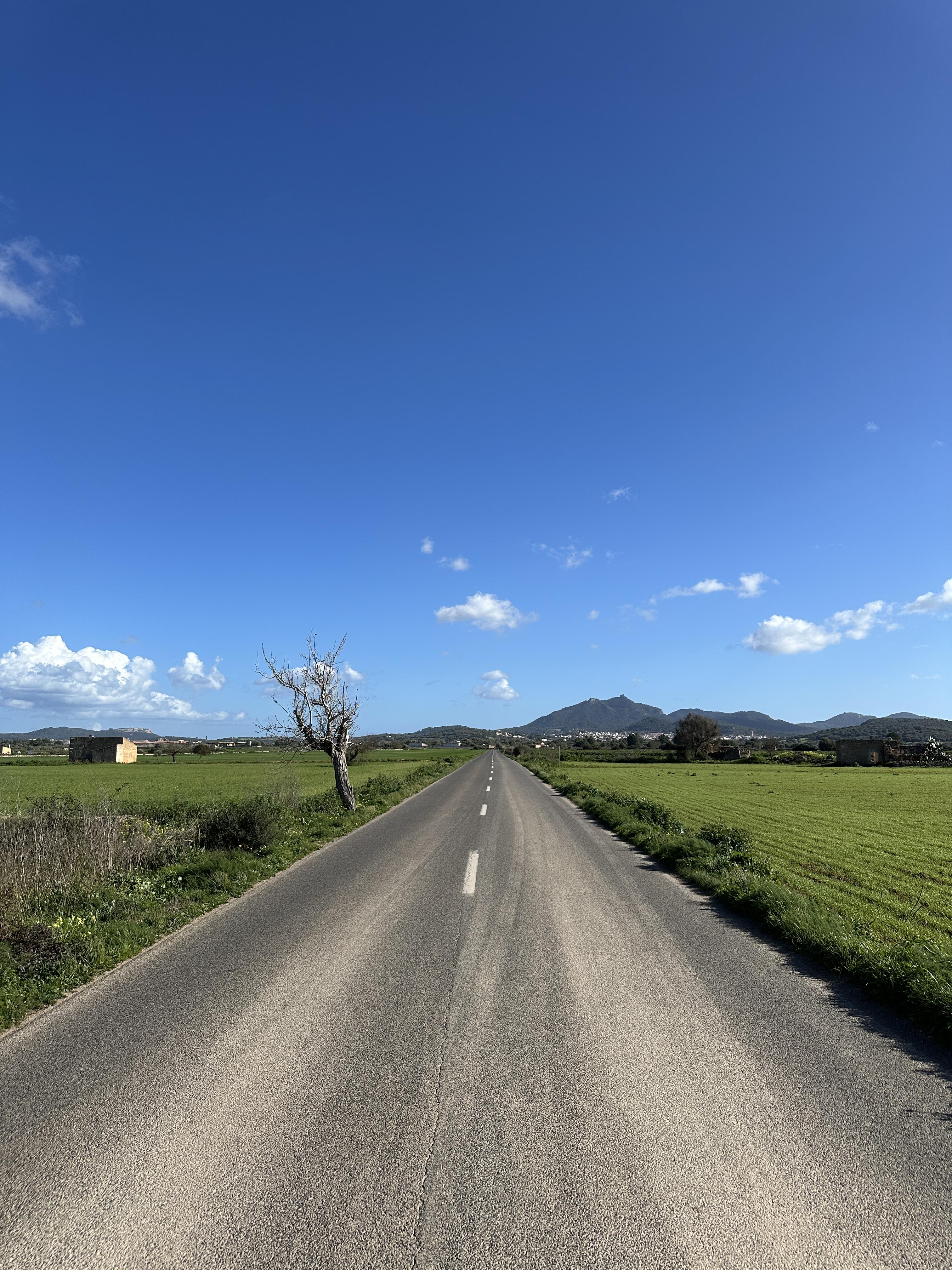 Scenic countryside road in Mallorca along the motorcycle route from Palma to Sant Salvador Sanctuary.